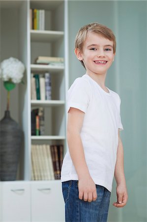 simsearch:693-06379441,k - Portrait of a young boy in casuals smiling at home Stock Photo - Premium Royalty-Free, Code: 693-06379451