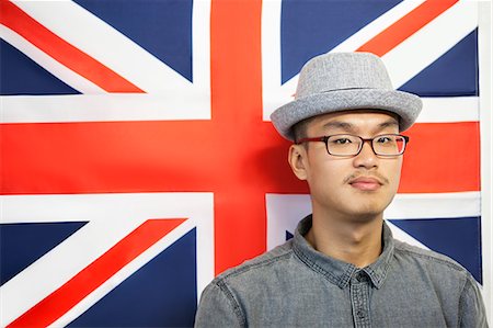 Portrait of a mid adult man against British flag Foto de stock - Sin royalties Premium, Código: 693-06379638