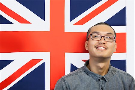 Contemplated man looking away while against British flag Foto de stock - Sin royalties Premium, Código: 693-06379639