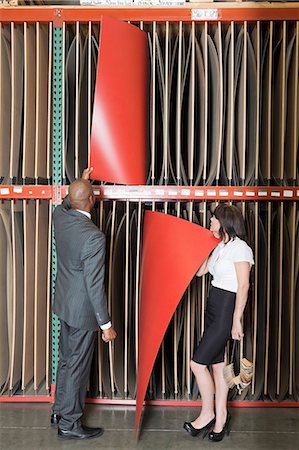 factory, african american - Multiethnic business colleagues selecting thin red veneer sheets Stock Photo - Premium Royalty-Free, Code: 693-06379749