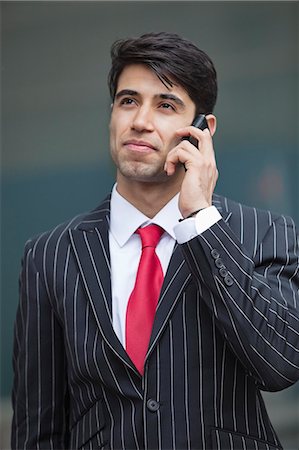 simsearch:693-06435813,k - Young Indian businessman communicating on cell phone Foto de stock - Sin royalties Premium, Código: 693-06379823