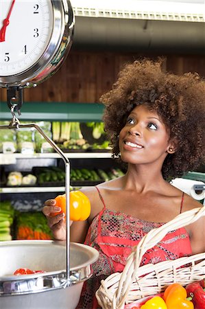 people scales - African American woman weighing bell peppers on scale at supermarket Stock Photo - Premium Royalty-Free, Code: 693-06403163