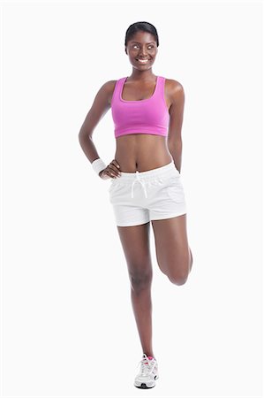 sostén deportivo - Young African American woman exercising over white background Foto de stock - Sin royalties Premium, Código: 693-06403328