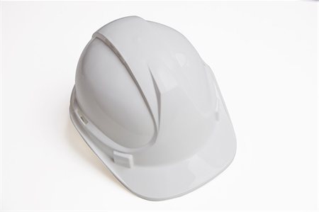 Close-up of hard hat over white background Stock Photo - Premium Royalty-Free, Code: 693-06403340