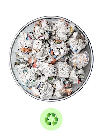 paper stacked - Crumpled papers in garbage bin with recycling sign over white background Stock Photo - Premium Royalty-Free, Code: 693-06403371