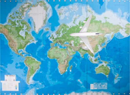 Model airplane flying over world map Foto de stock - Sin royalties Premium, Código: 693-06435798