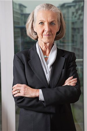 Portrait of confident senior businesswoman with arms crossed Stock Photo - Premium Royalty-Free, Code: 693-06435936