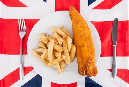 fries - Close-up of junk food with fork and table knife over British flag Stock Photo - Premium Royalty-Free, Code: 693-06497615