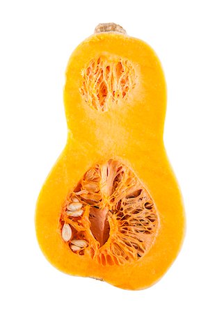 squash seeds - Half butternut squash over white background Stock Photo - Premium Royalty-Free, Code: 693-06497624