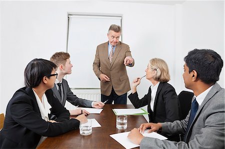 senior office - Multiethnic businesspeople at meeting in conference room Stock Photo - Premium Royalty-Free, Code: 693-06497659