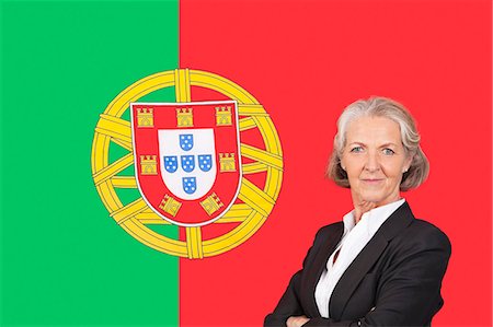 simsearch:693-06497648,k - Portrait of senior businesswoman with pride over Portuguese flag Photographie de stock - Premium Libres de Droits, Code: 693-06497695