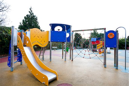 Slide and climbing web in children's playground Stock Photo - Premium Royalty-Free, Code: 693-06667845