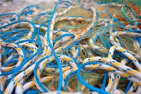 Close-up of a section of fishing net with attachment ring Stock