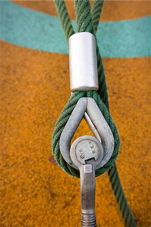 fastening - Eye bolt secures cable to the ground Stock Photo - Premium Royalty-Free, Code: 693-06667853