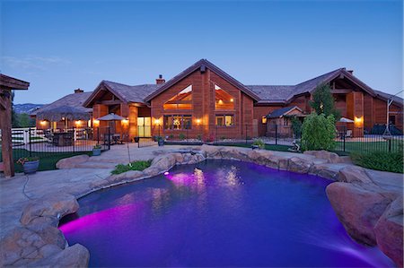 residential house pool - Entrance to a ranch home exterior at dusk Stock Photo - Premium Royalty-Free, Code: 693-06667910