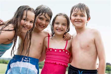 preteen wet - Portrait of boys and girls in swimsuits smiling together Stock Photo - Premium Royalty-Free, Code: 693-06668041
