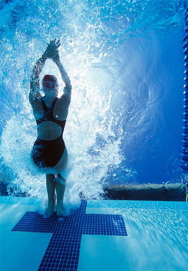 Rear view of female swimmer in competition Stock Photo - Premium Royalty-Free, Image code: 693-06668080