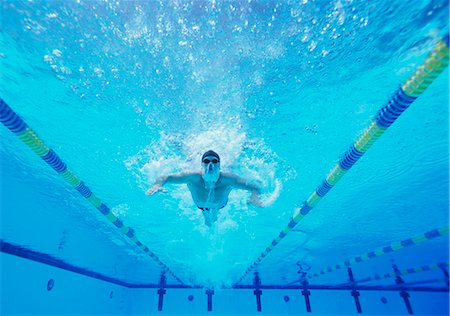 person looking up underwater - Underwater shot of male swimmer swimming in pool Stock Photo - Premium Royalty-Free, Code: 693-06668108