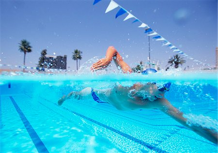 swimmer (male) - Young male athlete swimming in pool Stock Photo - Premium Royalty-Free, Code: 693-06668102