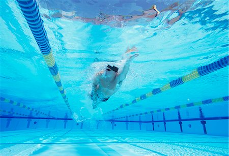 swimming - Underwater shot of young male athlete swimming in pool Stock Photo - Premium Royalty-Free, Code: 693-06668111