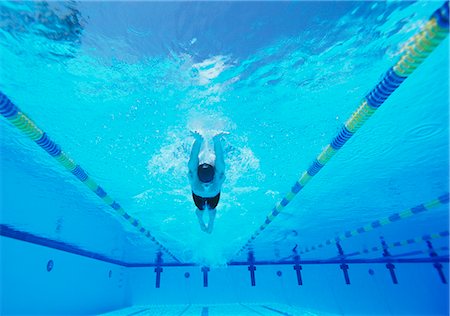 swimming cap underwater - Underwater shot of young male athlete swimming in pool Stock Photo - Premium Royalty-Free, Code: 693-06668113