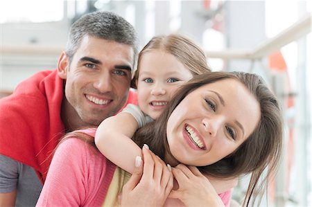 family of three kids hugging - Young happy family in shopping mall Stock Photo - Premium Royalty-Free, Code: 693-06967365