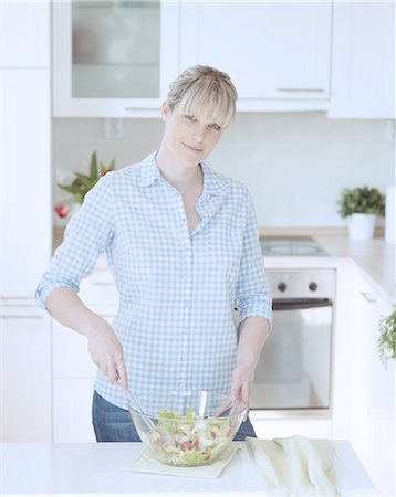 everyday - Young woman making salad Stock Photo - Premium Royalty-Free, Code: 693-06967478