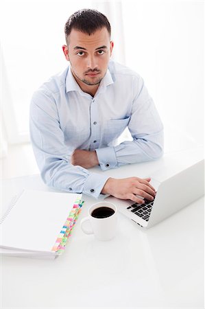 food for thought - Businessman working at desk Stock Photo - Premium Royalty-Free, Code: 693-07444415