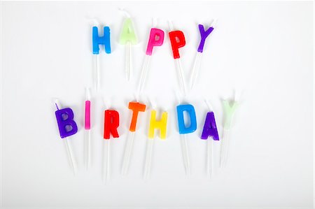 spell - Birthday candles against white background Stock Photo - Premium Royalty-Free, Code: 693-07455890