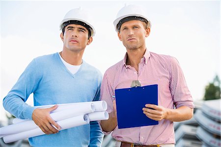 safety works - Architects with blueprint and clipboard standing at site Stock Photo - Premium Royalty-Free, Code: 693-07456137