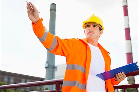 safety industry - Male architect with clipboard at industry Stock Photo - Premium Royalty-Free, Code: 693-07456186