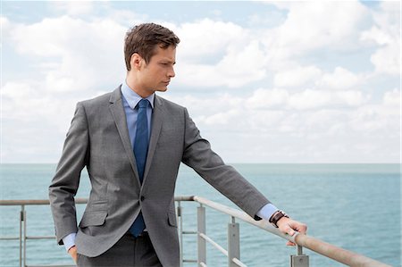 simsearch:693-07456224,k - Worried businessman standing by terrace railings Stock Photo - Premium Royalty-Free, Code: 693-07456219