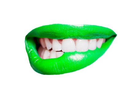 Close-up of teeth biting green lip over white background Photographie de stock - Premium Libres de Droits, Code: 693-07456328
