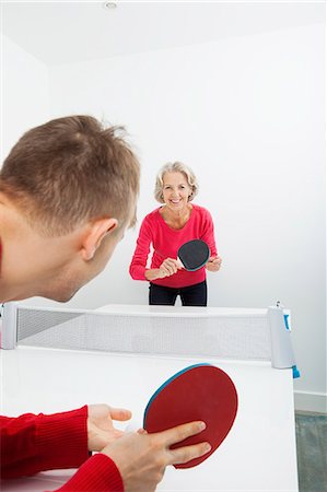 seniors sport competition - Portrait of senior woman playing table tennis in court Stock Photo - Premium Royalty-Free, Code: 693-07456475