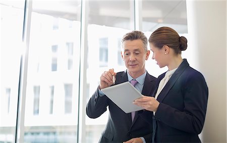 poland - Business people using tablet PC in office Stock Photo - Premium Royalty-Free, Code: 693-07542145