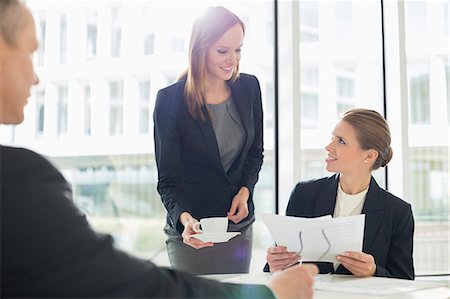 female and meeting and thirties - Businesswomen working at cafeteria Stock Photo - Premium Royalty-Free, Code: 693-07542182