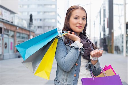 portrait shopping - Portrait of woman carrying shopping bags Stock Photo - Premium Royalty-Free, Code: 693-07542303