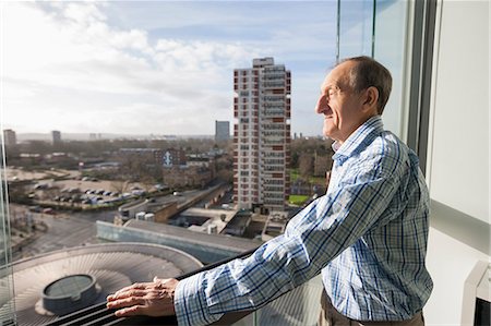 retire house - Side view of senior man standing on balcony Stock Photo - Premium Royalty-Free, Code: 693-07542375