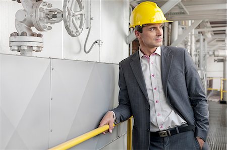 Young male architect in hand hat at industry Foto de stock - Sin royalties Premium, Código: 693-07672648