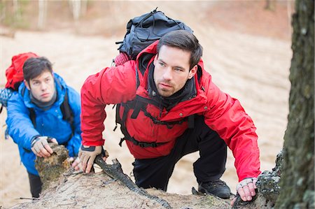 Young backpackers hiking in forest Stock Photo - Premium Royalty-Free, Code: 693-07673000