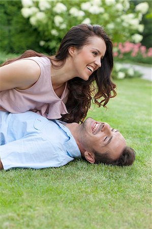 simsearch:693-07672803,k - Playful young couple having leisure time in park Stock Photo - Premium Royalty-Free, Code: 693-07673054