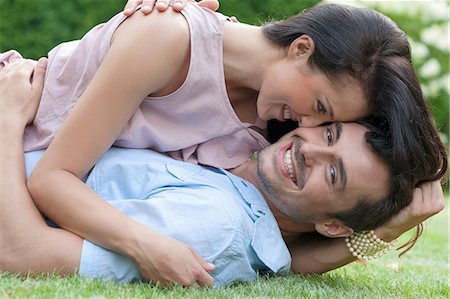 simsearch:693-07672803,k - Portrait of loving young couple enjoying together in park Stock Photo - Premium Royalty-Free, Code: 693-07673056