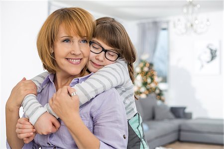 simsearch:693-07673222,k - Loving daughter embracing mother at home Stock Photo - Premium Royalty-Free, Code: 693-07673218