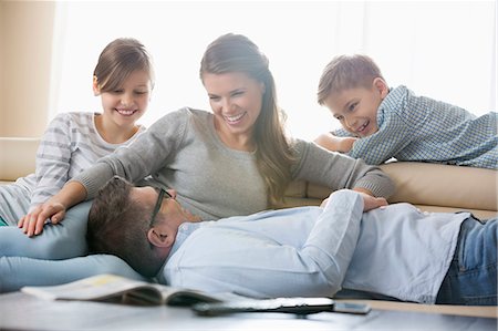 simsearch:6109-06005142,k - Happy family in living room Stock Photo - Premium Royalty-Free, Code: 693-07673260
