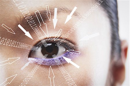 data numbers - Close-up portrait of businesswoman with binary digits and arrow signs moving towards his eye Stock Photo - Premium Royalty-Free, Code: 693-07673292