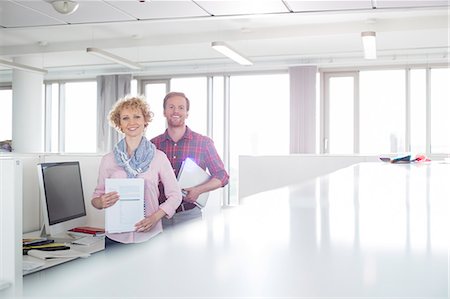 simsearch:693-07912462,k - Portrait of confident business people standing in office Stock Photo - Premium Royalty-Free, Code: 693-07913025