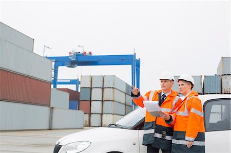 simsearch:693-07913158,k - Workers examining cargo in shipping yard Stock Photo - Premium Royalty-Free, Code: 693-07913063