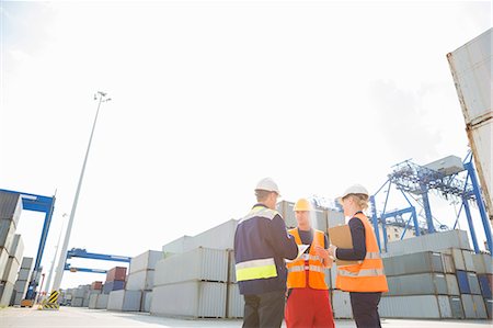 simsearch:693-07913158,k - Workers talking in shipping yard Stock Photo - Premium Royalty-Free, Code: 693-07913138