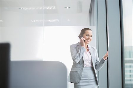 simsearch:693-06403498,k - Portrait of confident young businesswoman in office Stock Photo - Premium Royalty-Free, Code: 693-07913241