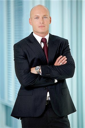 Portrait of young caucasian businessman in office Stock Photo - Premium Royalty-Free, Code: 693-08127607